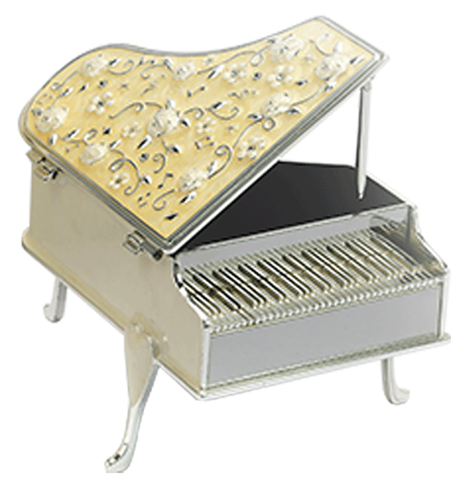 a trinket box shaped like a piano with enameled designer top and which plays a sweet music