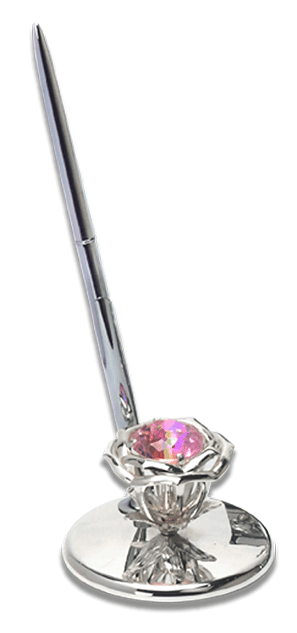 a gorgeous pen stand with a sleek pen and a bright pink colored stone in a flower attached to its base