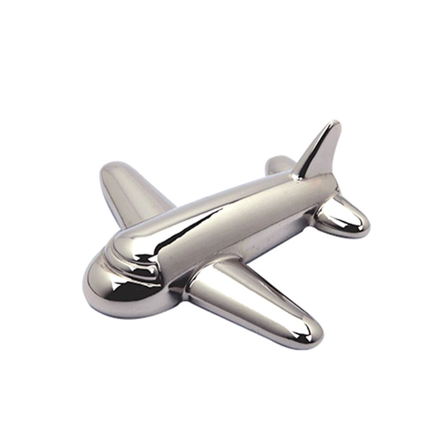 An amazing silver paperweight shaped like an airplane.
