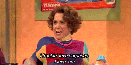 a gif with a girl exclaiming - i love surprises