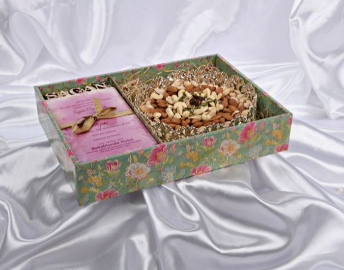 a special gift hamper with a delightful greeting card for diwali and premium dry fruits placed inside a silver tray