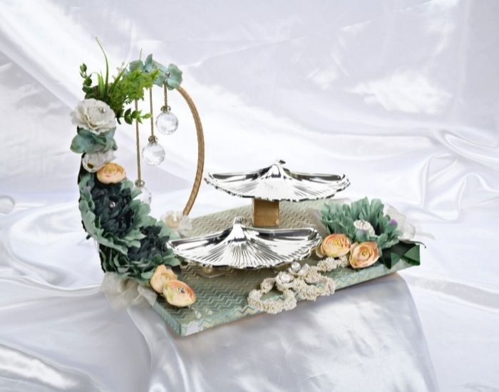 an ethereal gift hamper with two shell shaped silver platters that are great for diwali gifting