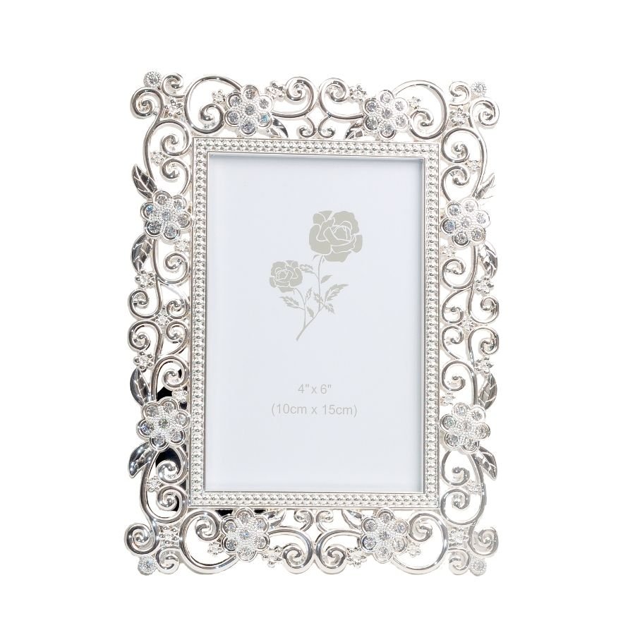 A luminously beautiful photo frame with delicate patterns on its borders made of silver