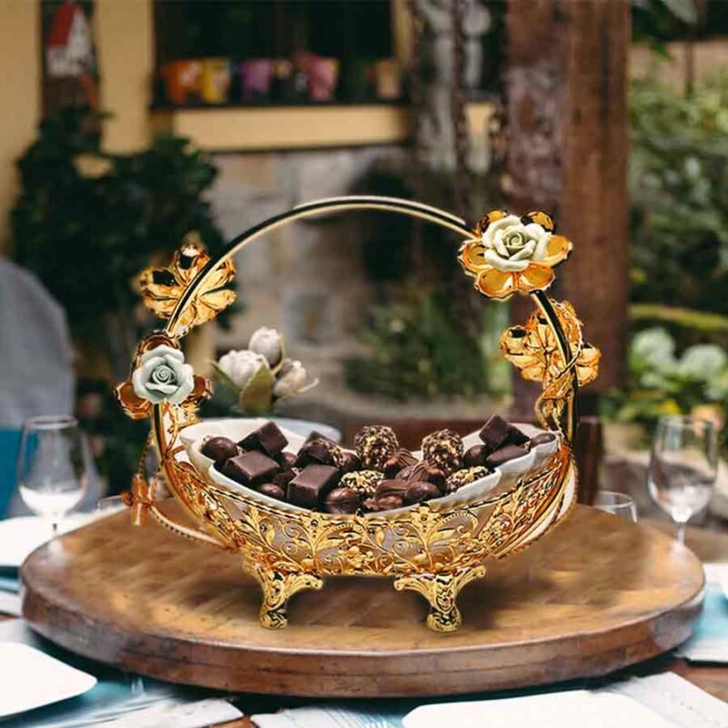 Vintage Floral Golden Basket with chocolates on a wooden platform.